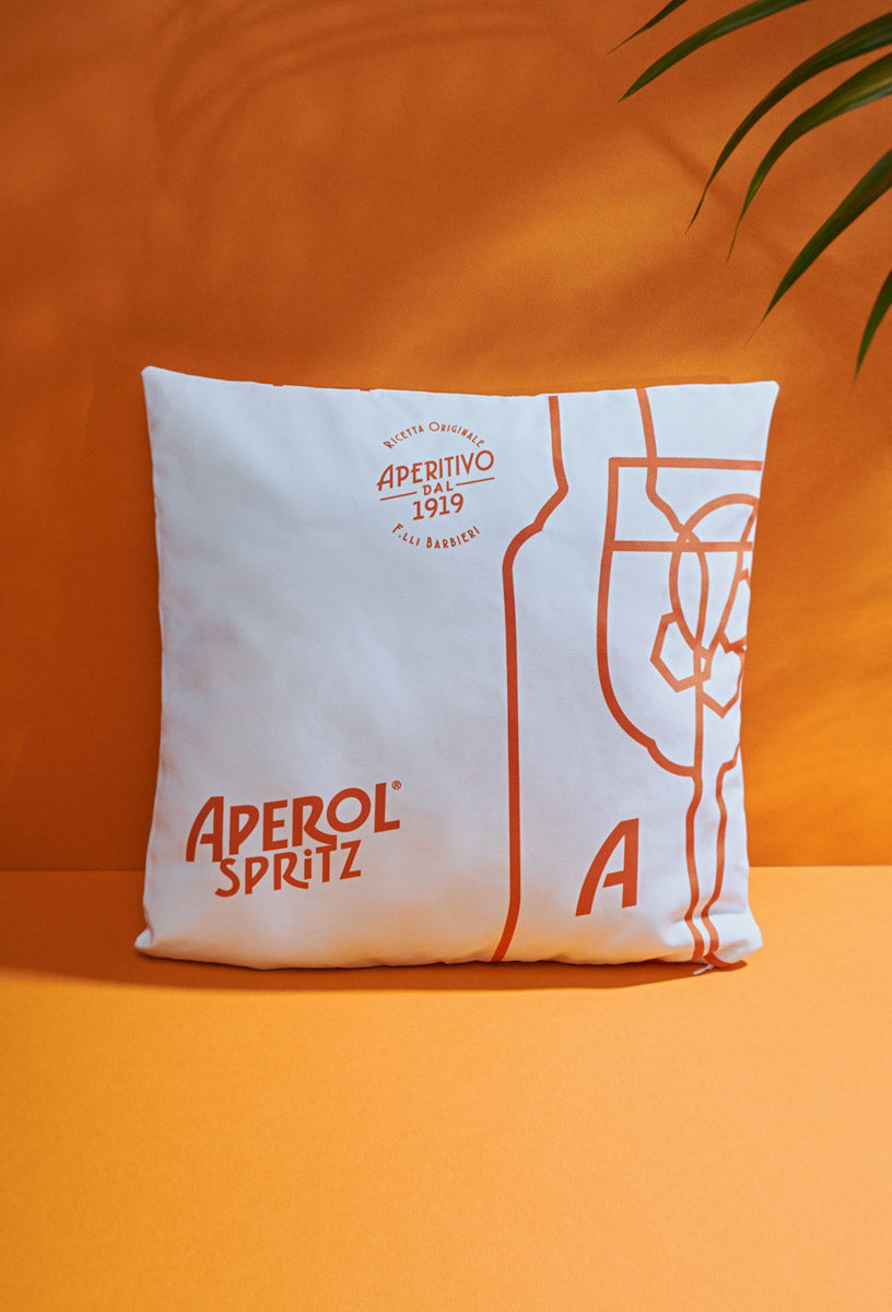 "Bouteille et verre Aperol Spritz" coussin blanc/orange 